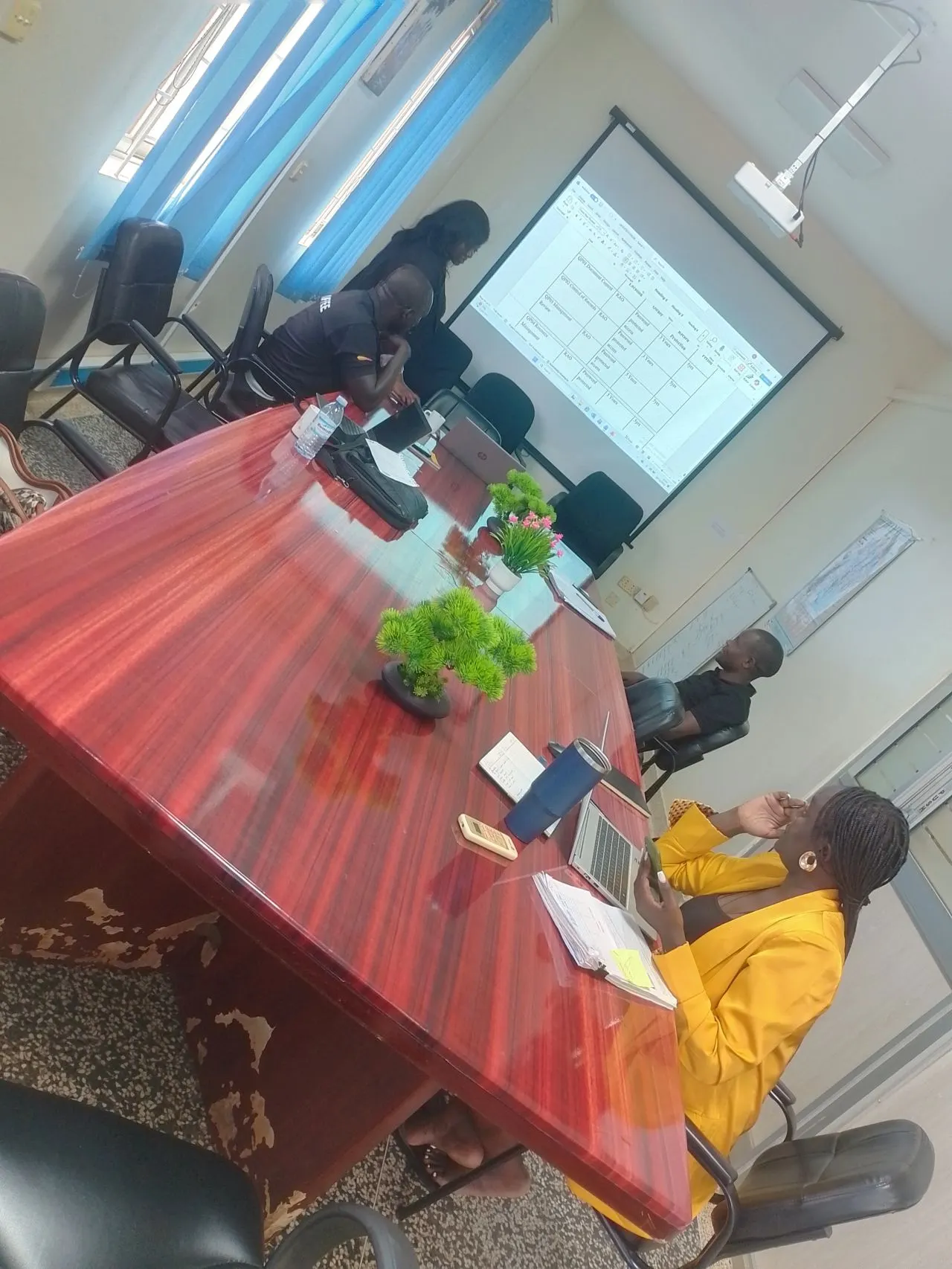 ISO 9001 quality management system implementation meeting reviewing a document register